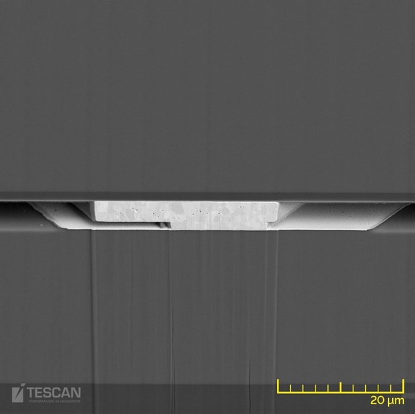Detailed image of the bonding layer located at 300 μm below the surface