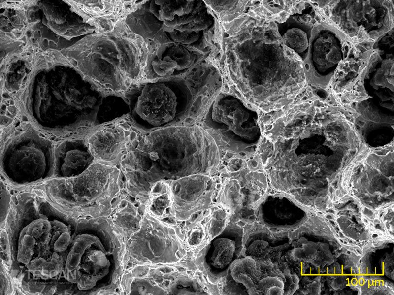 Austempered ductile iron fracture surface Austempered ductile iron fracture surface (chụp bằng Kính hiển vi điện tử quét SEM TESCAN)